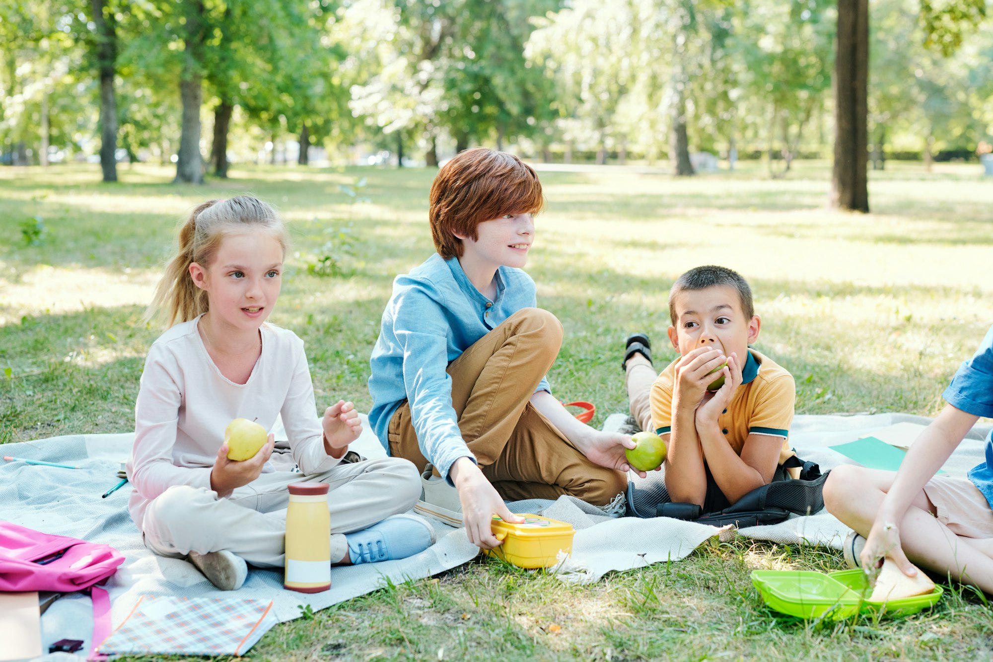 Kids having picnic in park